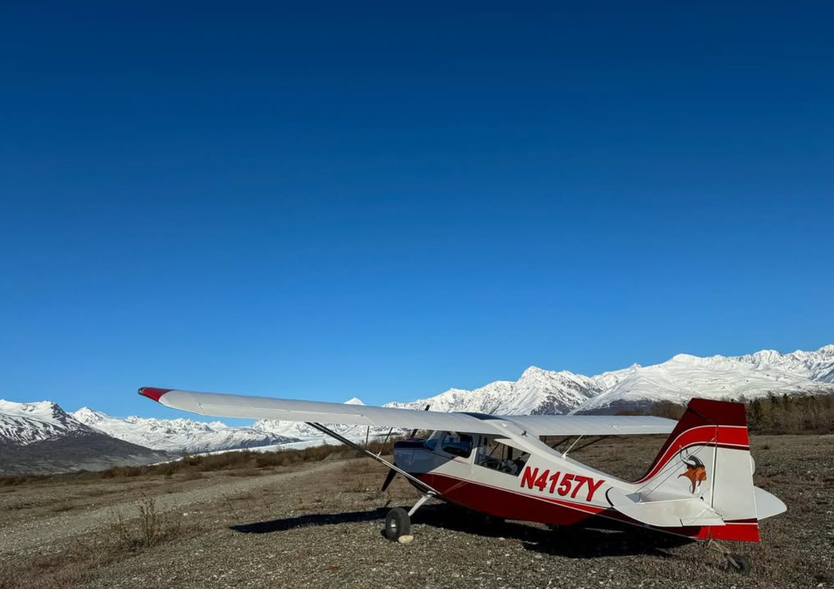 Light aircraft parked in the Alaska mountains.